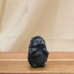 HEDGEHOG HOLDING MUSHROOM CANDLE